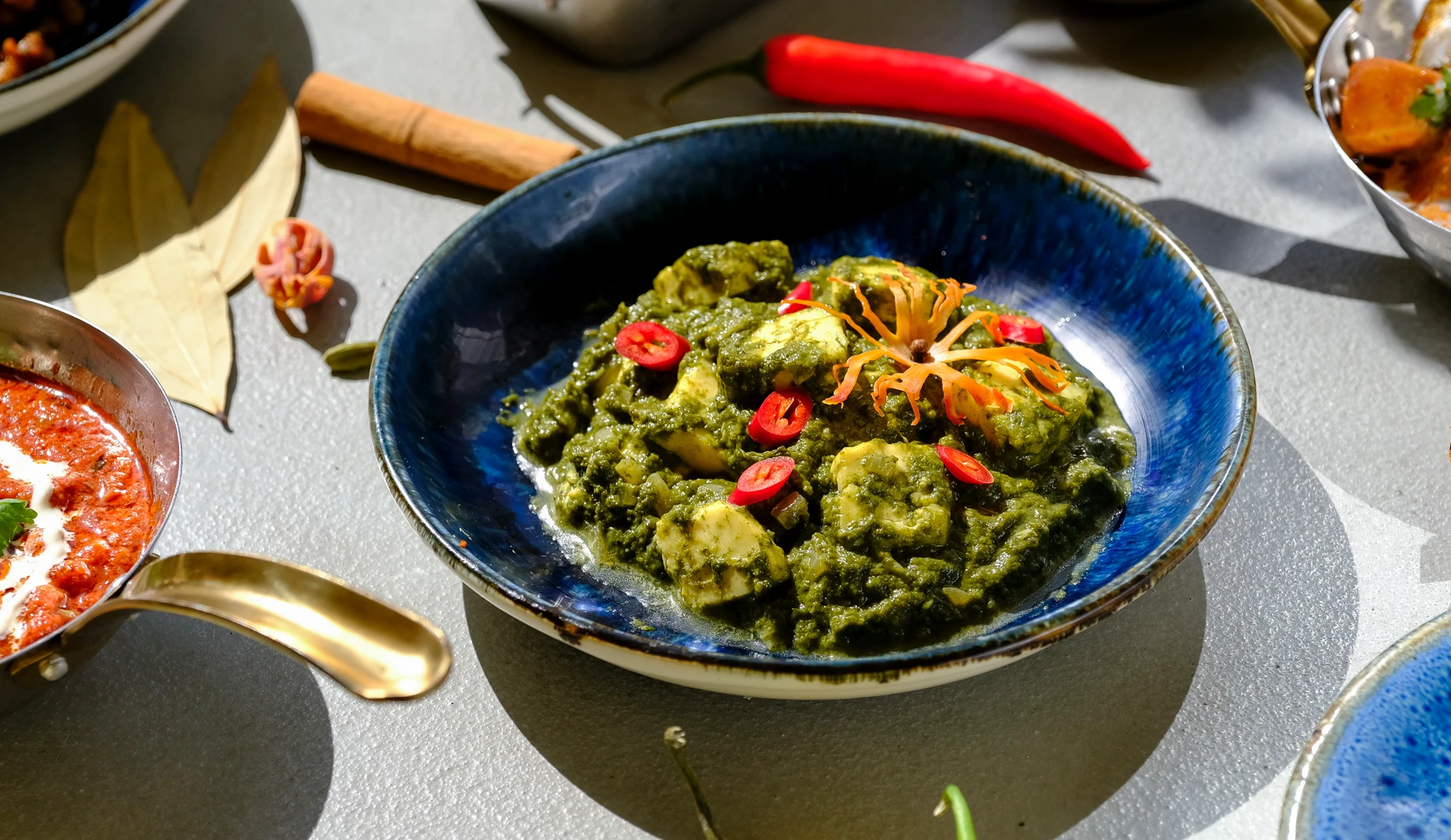 A green curry photographed for Inder’n in 2025