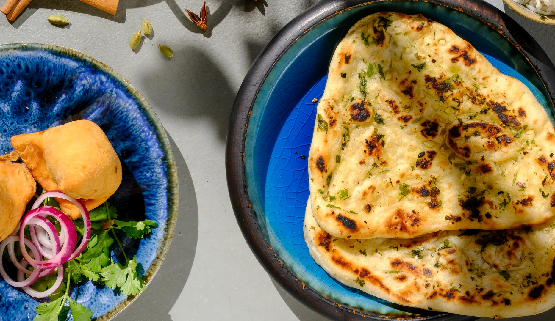 Naan and samosas photographed for an Inder'n campaign in 2025